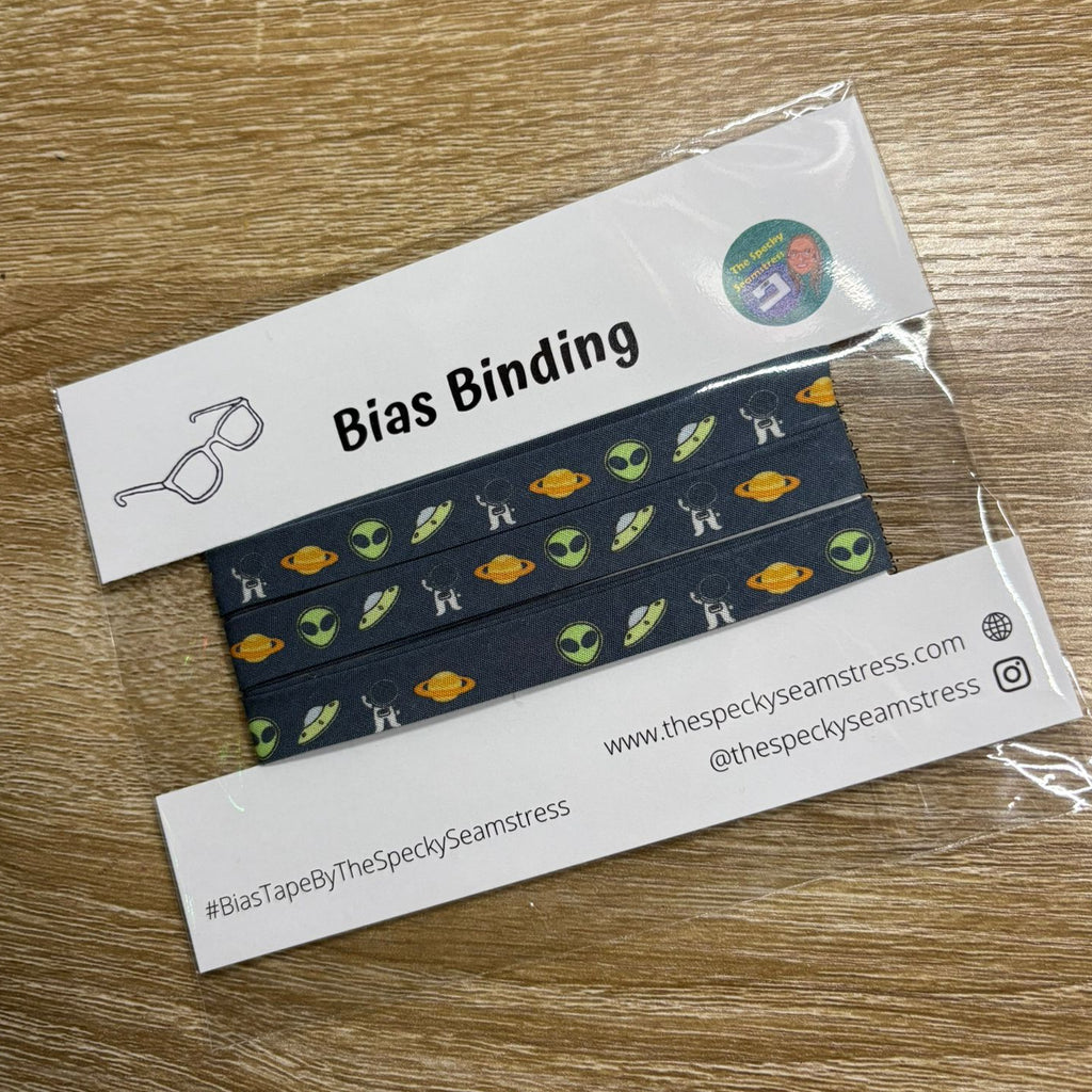 Aliens Slate bias in packaging on a wooden background. 