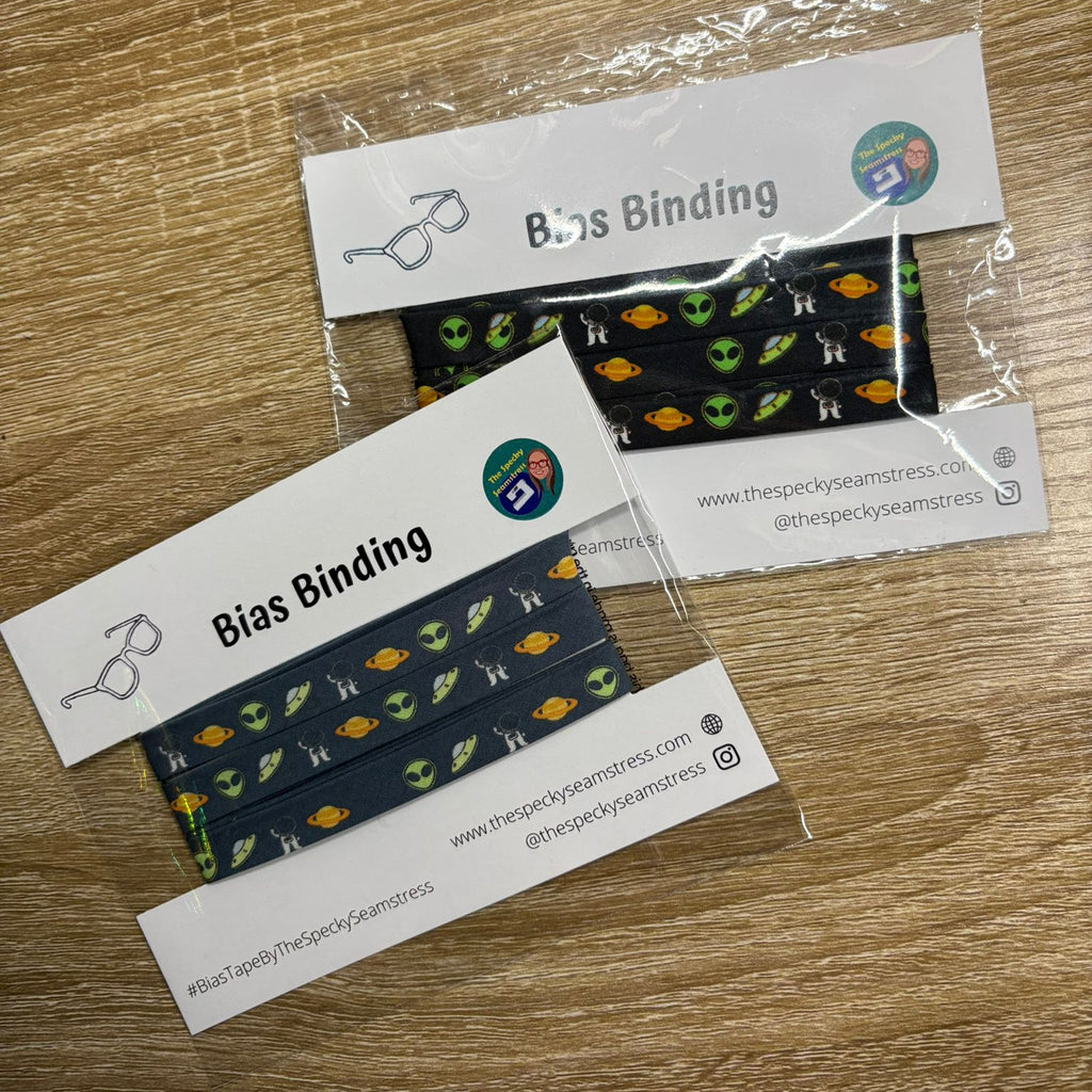 Aliens Slate bias on top of Aliens bias in packaging on a wooden background. 
