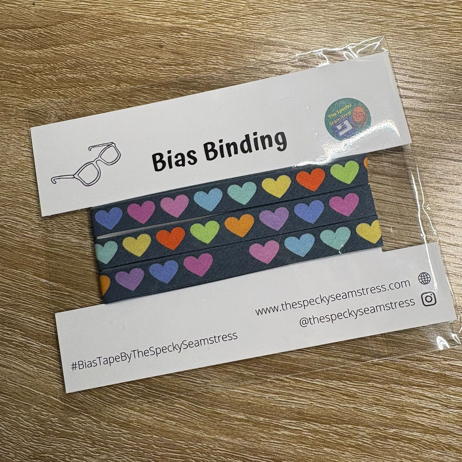 Disco Hearts Slate bias in packaging on wooden background. 