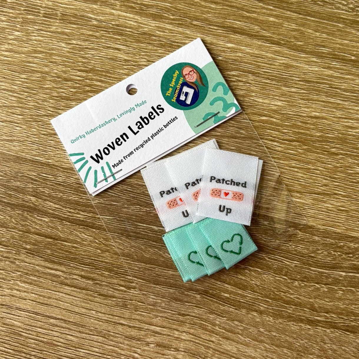 A bag of mixed labels on a wooden surface. 