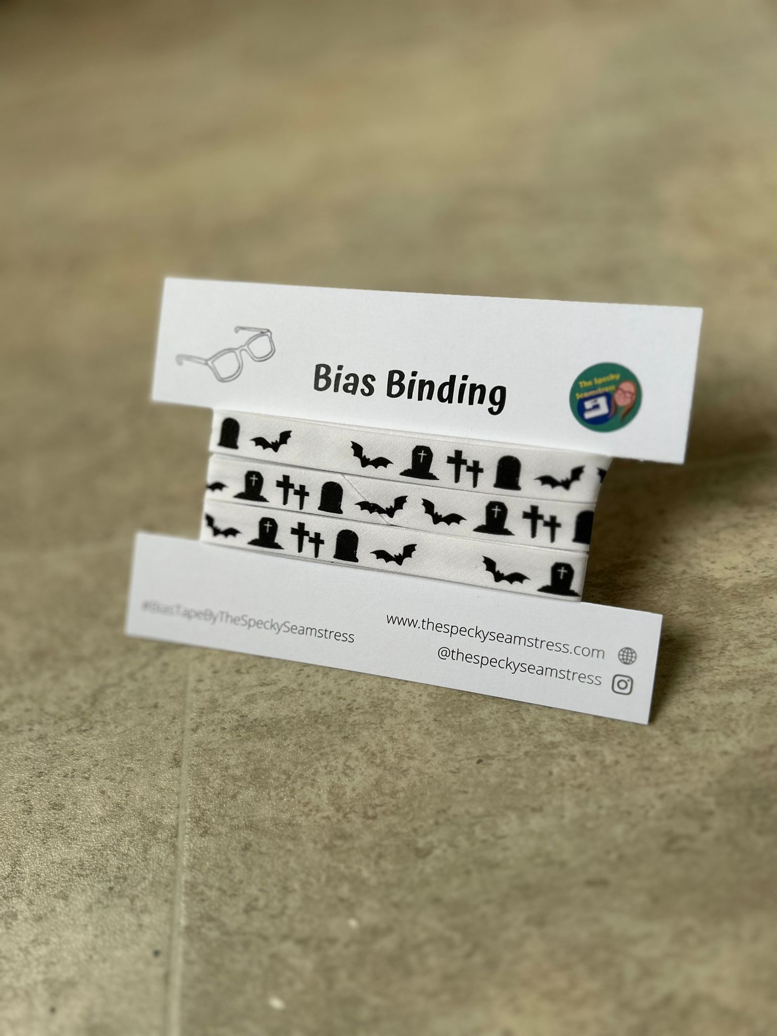 Spooky Graveyard bias wrapped around a white cardboard display card on a cream background.