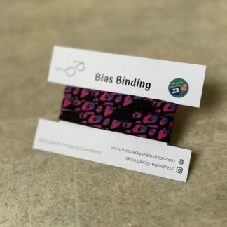 Pink Leopard bias wrapped around a white display card on a cream background.