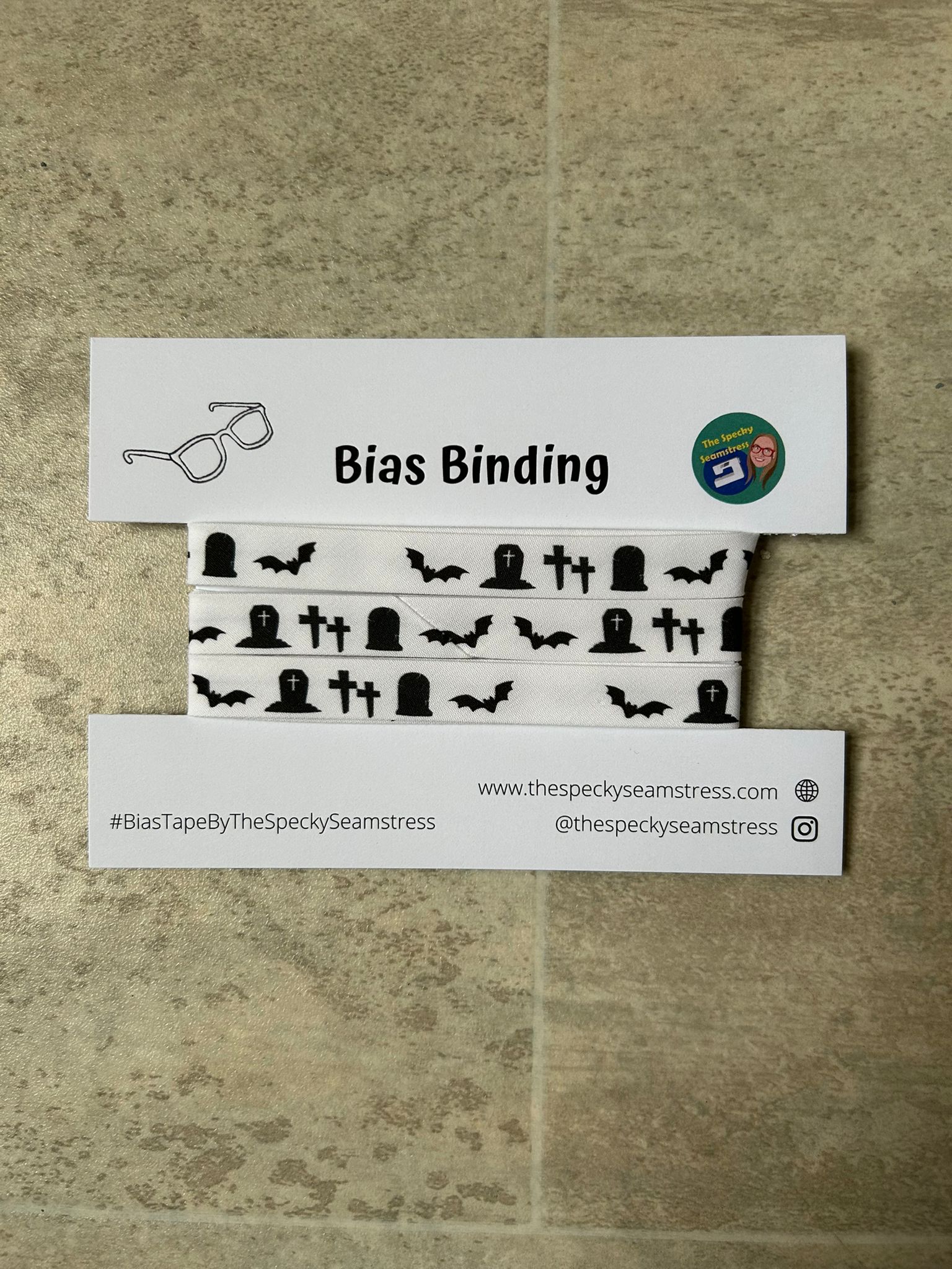 Spooky Graveyard bias wrapped around a white cardboard display card on a cream background.